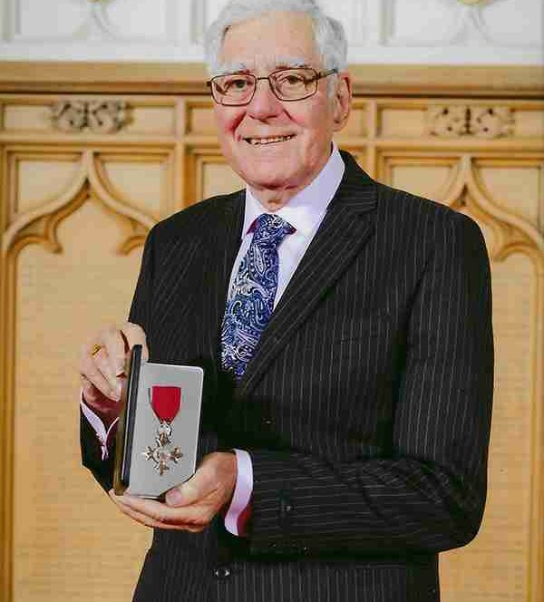 Holding MBE